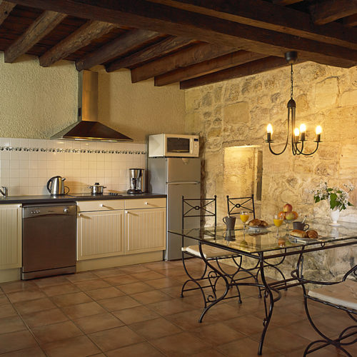 The kitchen area is light and well-equipped with dishwasher etc